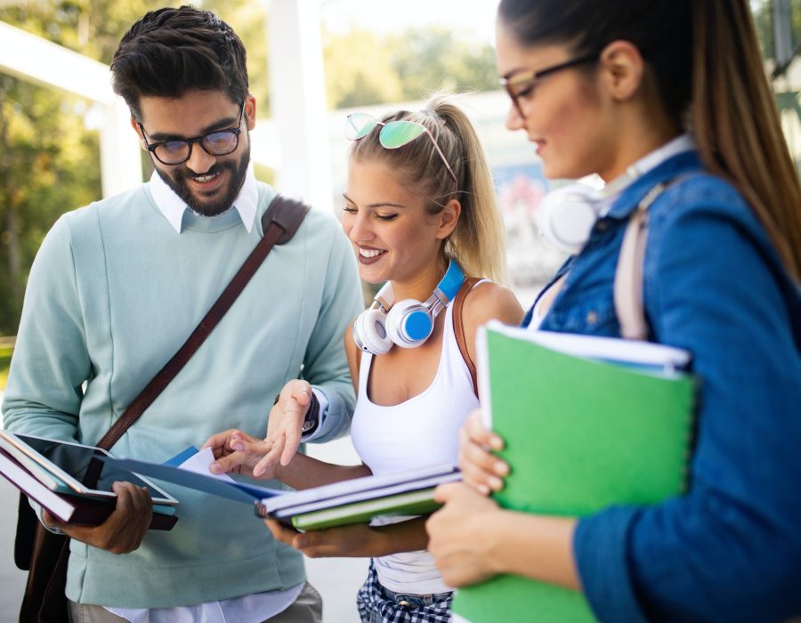 happy-young-university-students-friends-studying-with-books-at-university.jpg